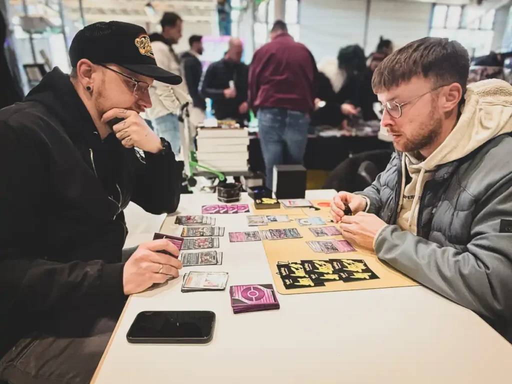 Two guys plaing Pokemon TCG